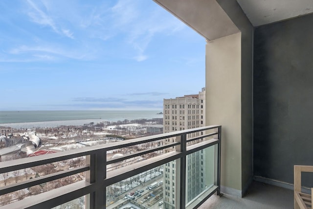 balcony featuring a water view