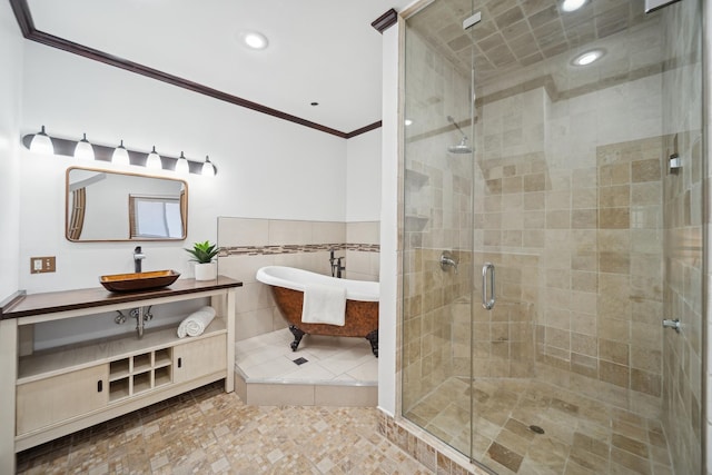 bathroom with vanity, shower with separate bathtub, crown molding, and tile walls