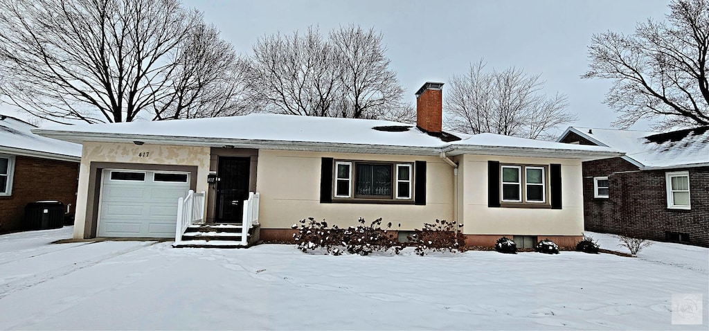 single story home featuring a garage