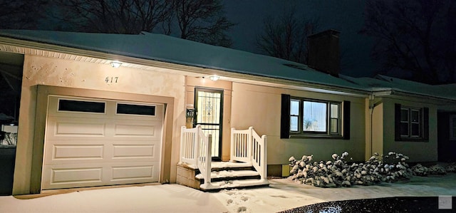 view of front of home with a garage