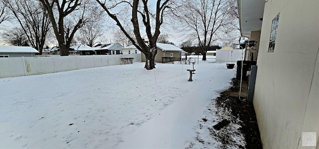 view of yard layered in snow