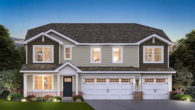 craftsman house featuring a garage, a yard, and a porch