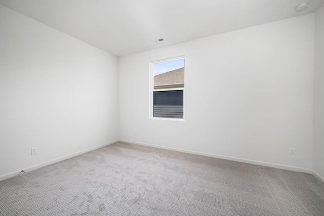 unfurnished room with carpet floors