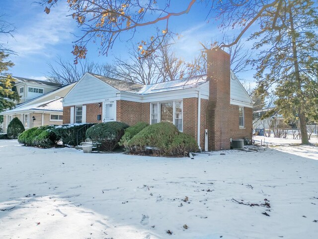 back of house with a lawn