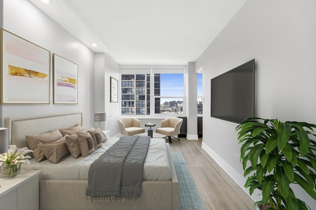 bedroom with light hardwood / wood-style floors