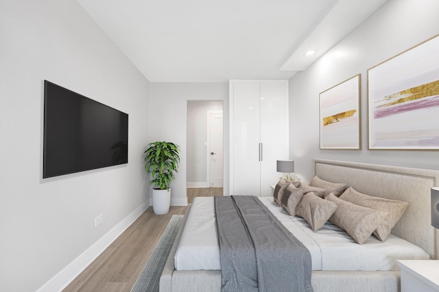 bedroom with light hardwood / wood-style flooring