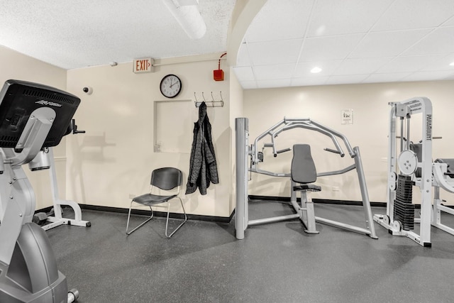 exercise area featuring a paneled ceiling