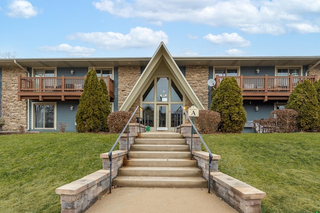 exterior space featuring french doors and a front lawn