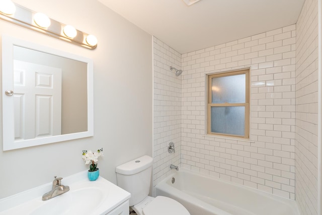 full bathroom featuring vanity, toilet, and tiled shower / bath