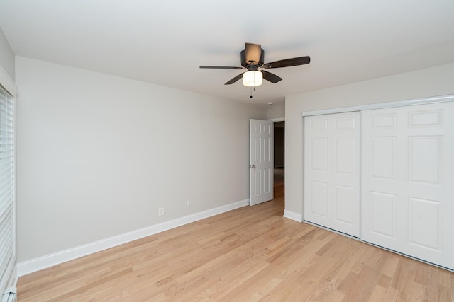 unfurnished bedroom featuring light hardwood / wood-style flooring, a closet, and ceiling fan