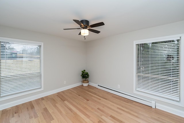 empty room with a baseboard radiator, ceiling fan, and light wood-type flooring