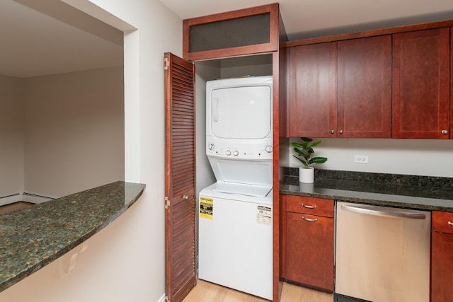 laundry area with stacked washer / dryer and light hardwood / wood-style floors