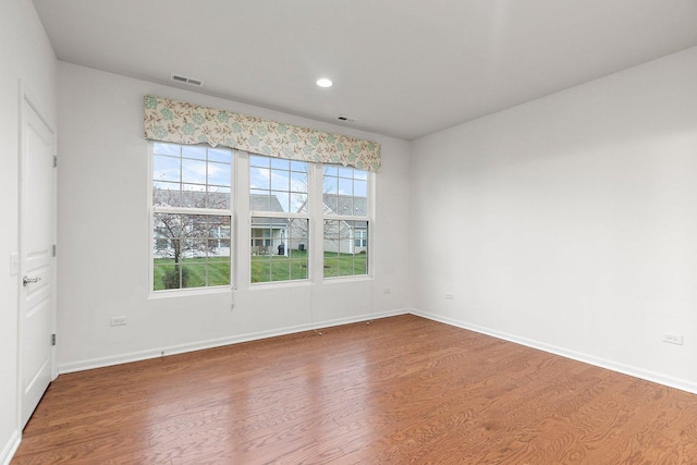 empty room featuring wood-type flooring