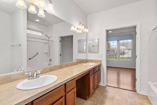 bathroom featuring shower / bathing tub combination, vanity, and tile patterned floors