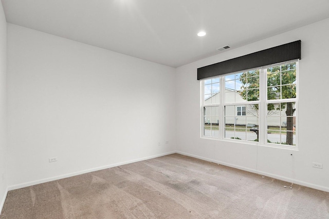 empty room featuring carpet flooring