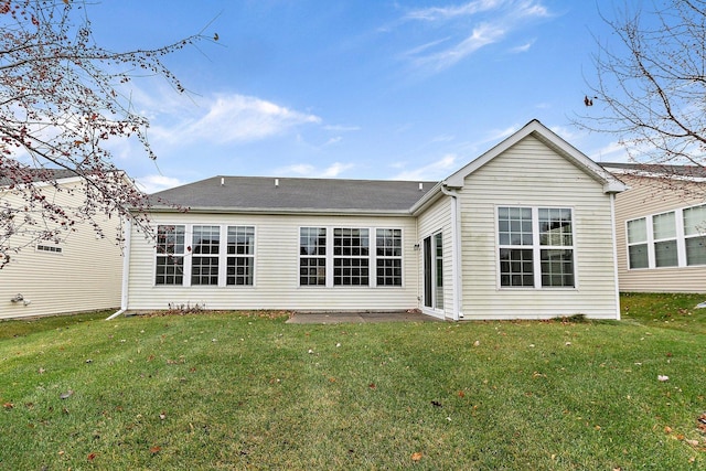 rear view of house with a lawn