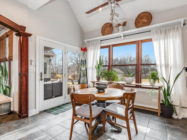 dining room featuring lofted ceiling and ceiling fan