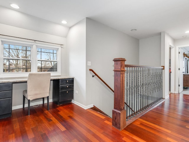 interior space featuring built in study area, recessed lighting, baseboards, and wood finished floors