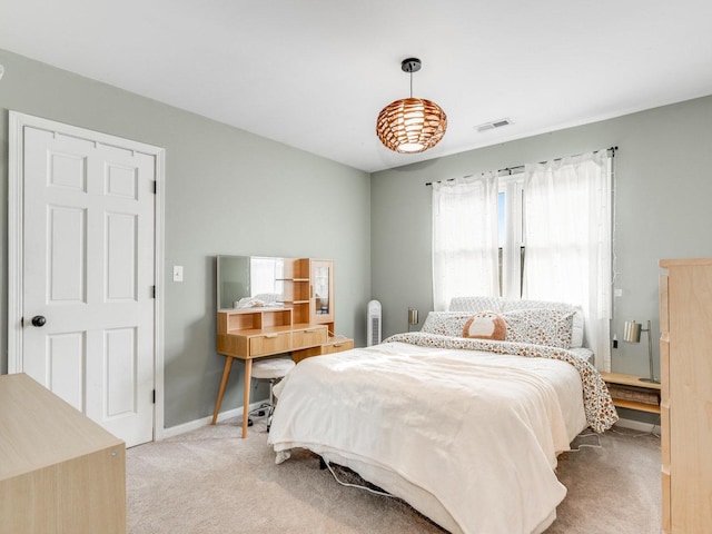 bedroom featuring light colored carpet