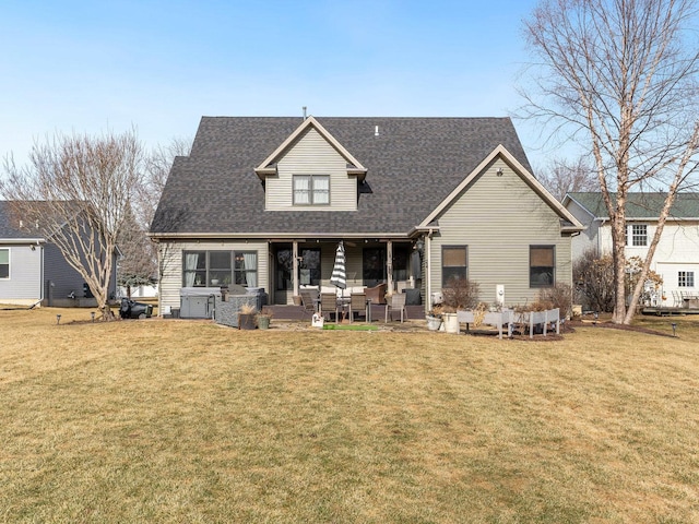 rear view of house featuring a yard and a patio area