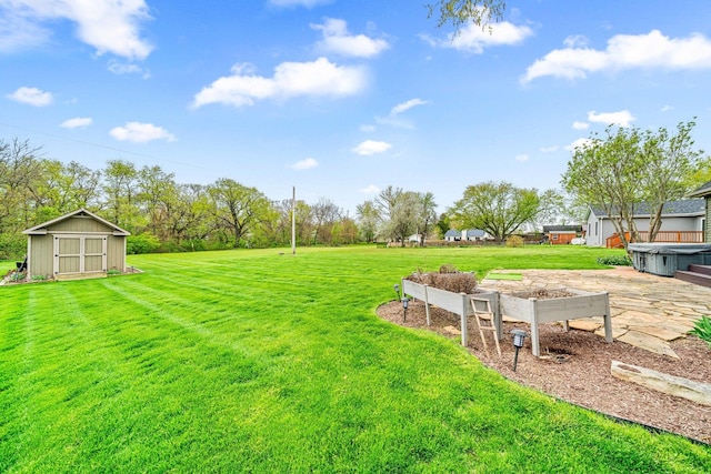 view of yard with an outdoor structure and a storage shed