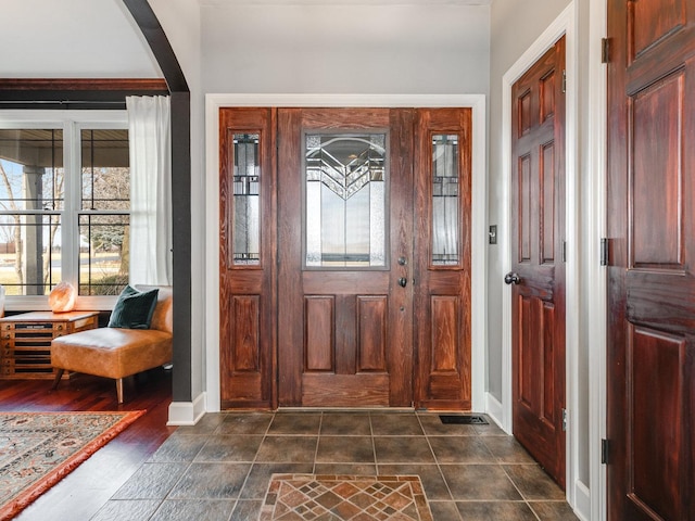 entrance foyer with dark hardwood / wood-style floors