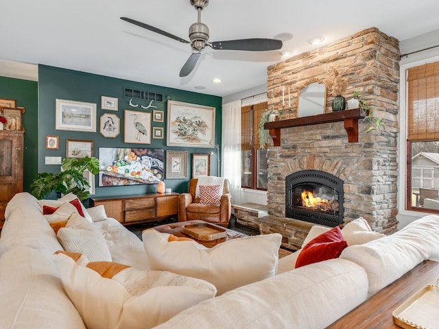 living room with a fireplace and wood-type flooring