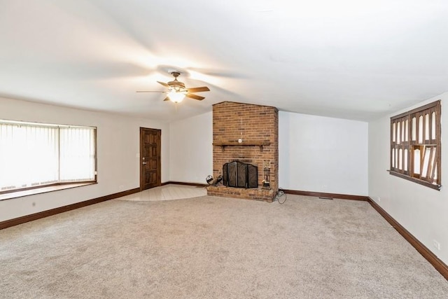 unfurnished living room featuring a fireplace, light colored carpet, ceiling fan, and lofted ceiling