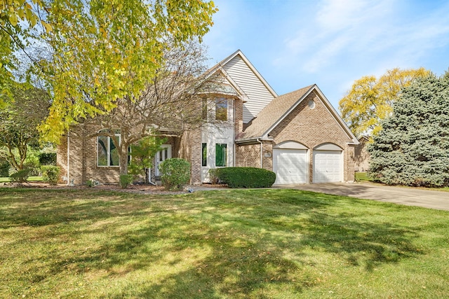 view of front of home featuring a garage and a front yard