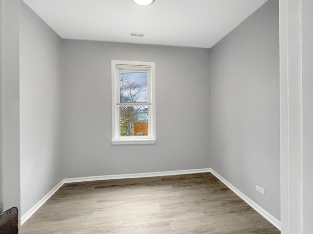 unfurnished room with light hardwood / wood-style floors