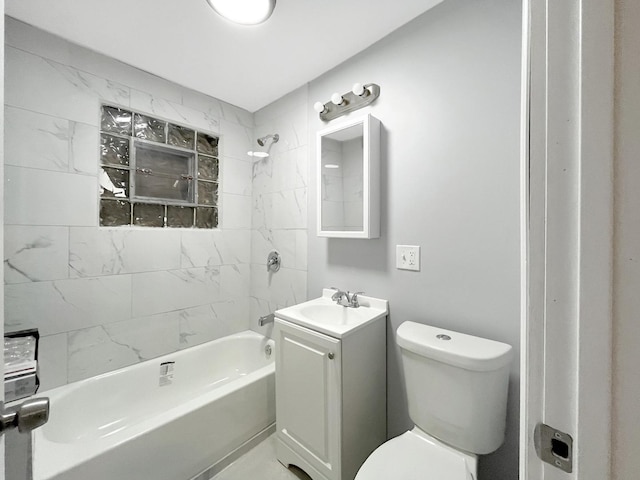 full bathroom featuring vanity, tiled shower / bath combo, and toilet