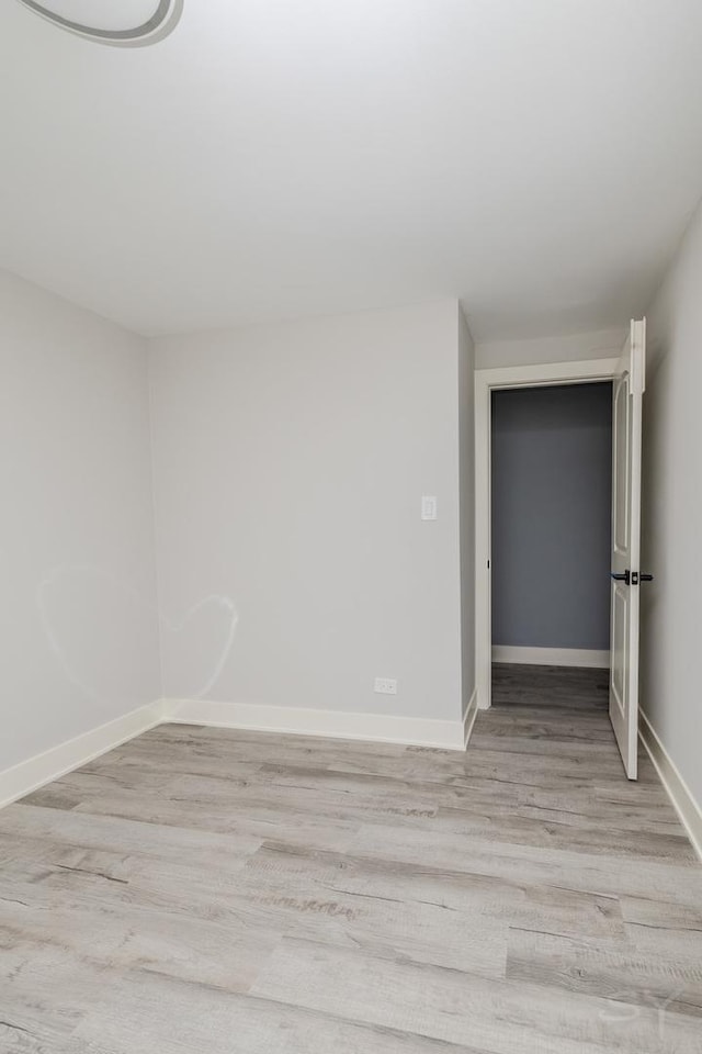 spare room with light hardwood / wood-style floors