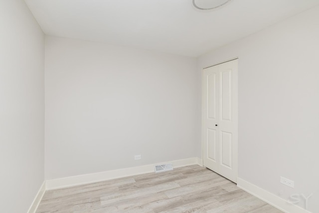 spare room with light wood-type flooring