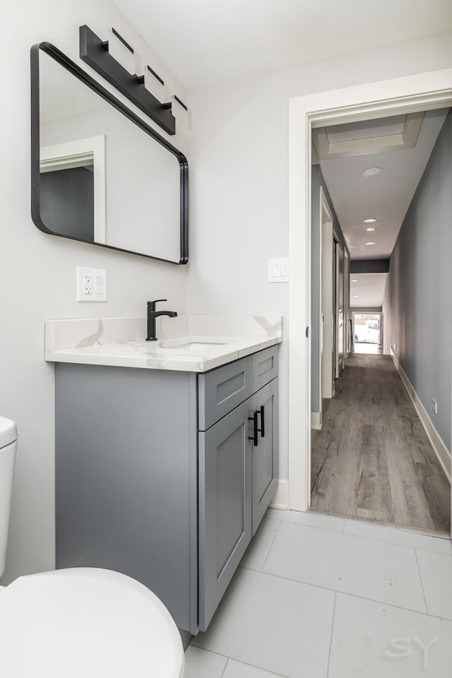 bathroom featuring vanity and toilet