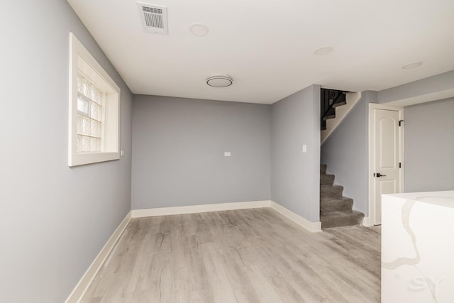 basement featuring light hardwood / wood-style floors