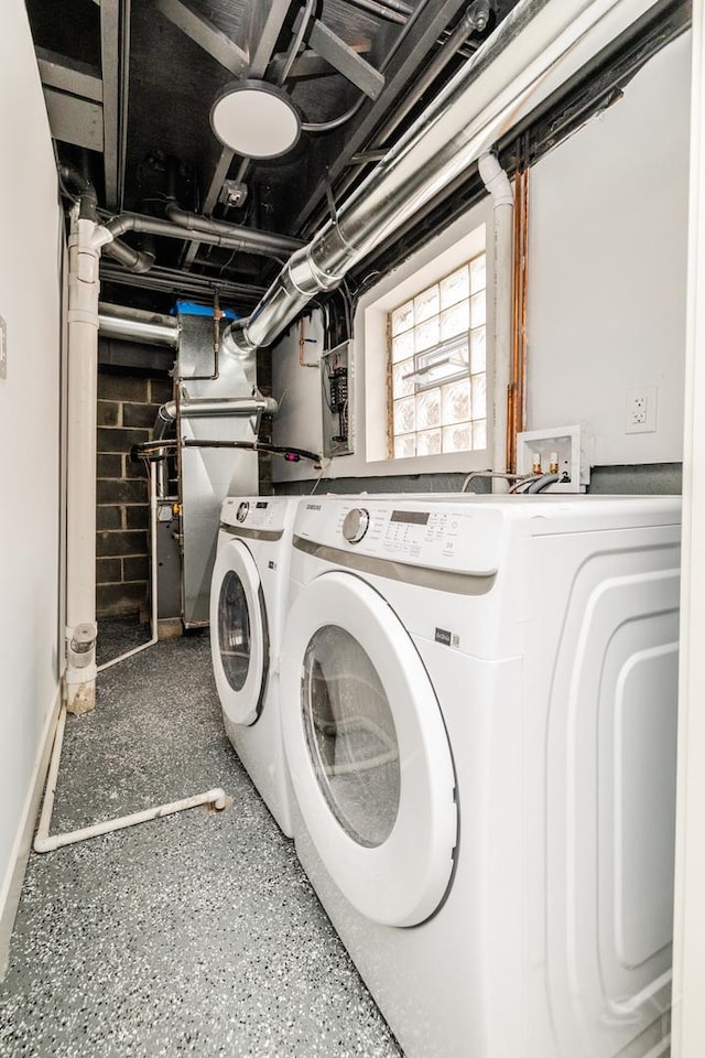 laundry room featuring washer and clothes dryer