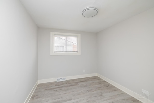 unfurnished room with light hardwood / wood-style flooring