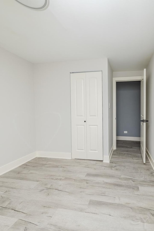 interior space featuring a closet and light wood-type flooring