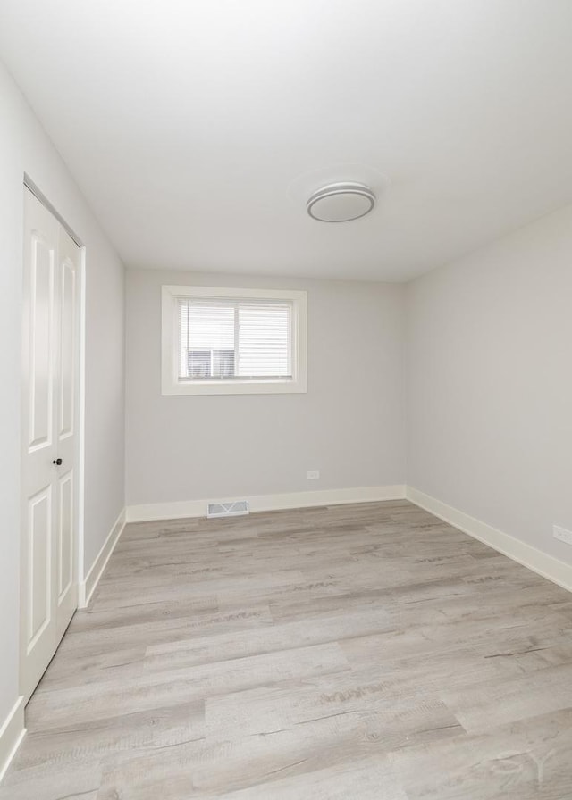 unfurnished room featuring light hardwood / wood-style flooring