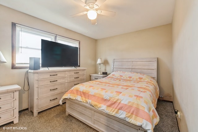 bedroom with ceiling fan and light carpet