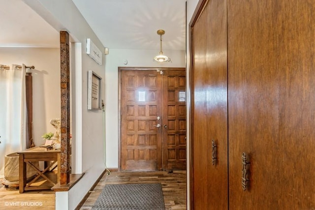 doorway with wood-type flooring