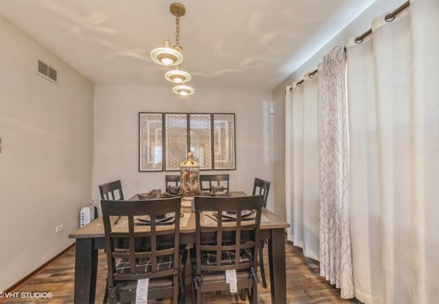 dining space featuring dark hardwood / wood-style floors