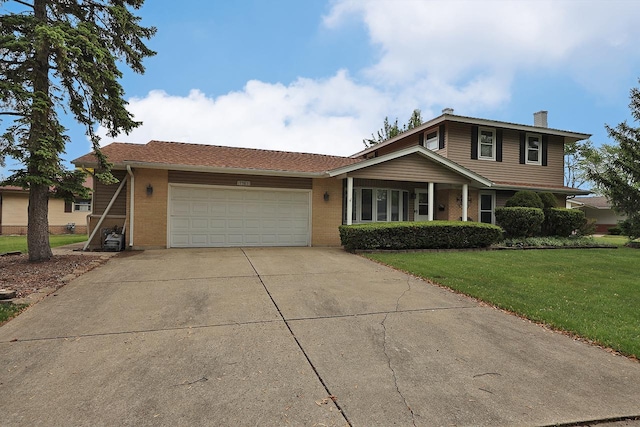 1141 Hartford Ln, Elk Grove Village, IL 60007 - view of front facade with brick siding, a garage, a chimney, driveway, and a front lawn