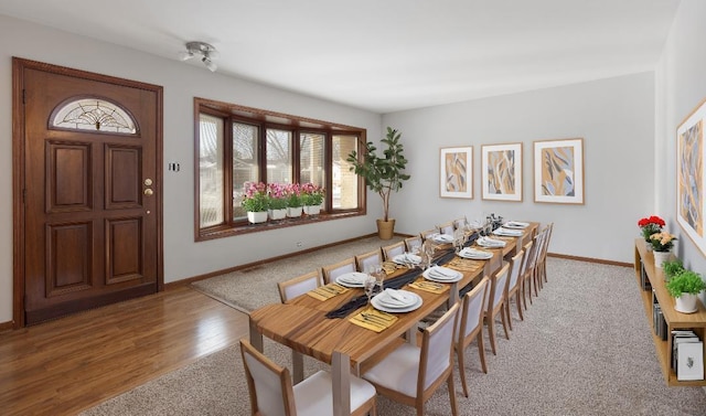 1141 Hartford Ln, Elk Grove Village, IL 60007 - dining room featuring plenty of natural light, baseboards, wood finished floors, and carpet flooring