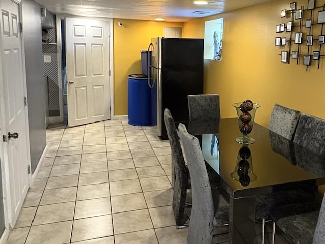 dining area with light tile patterned floors