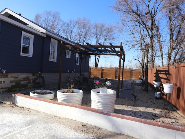 view of home's exterior featuring a pergola