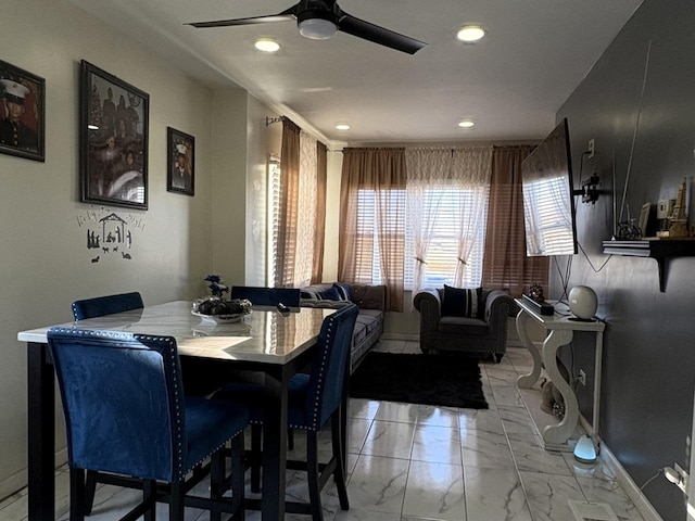 dining room with ceiling fan and a healthy amount of sunlight