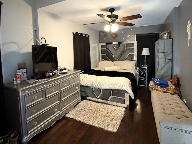 bedroom featuring ceiling fan and dark hardwood / wood-style floors