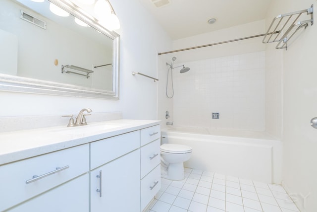 full bathroom featuring tile patterned flooring, vanity, toilet, and tiled shower / bath