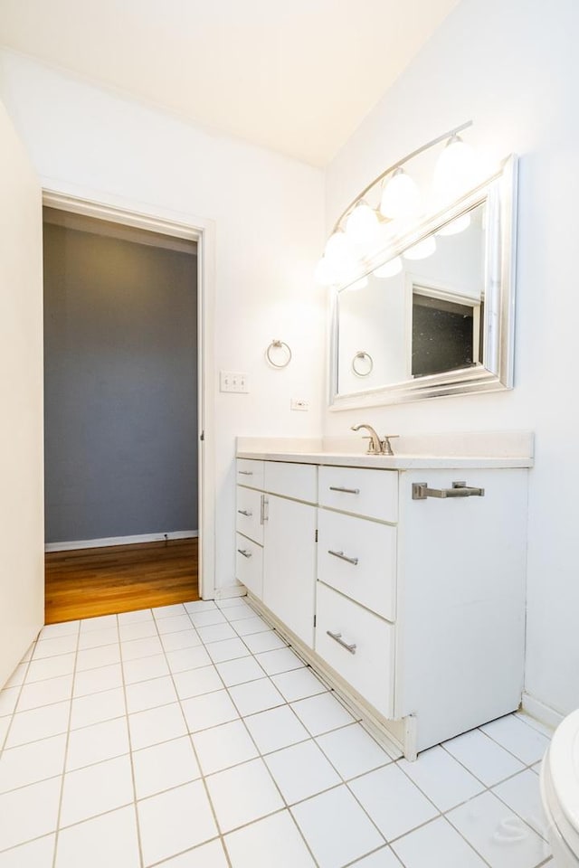 bathroom with tile patterned floors and vanity